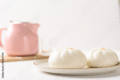Steamed Chinese bun on white background, a popular Asian street food