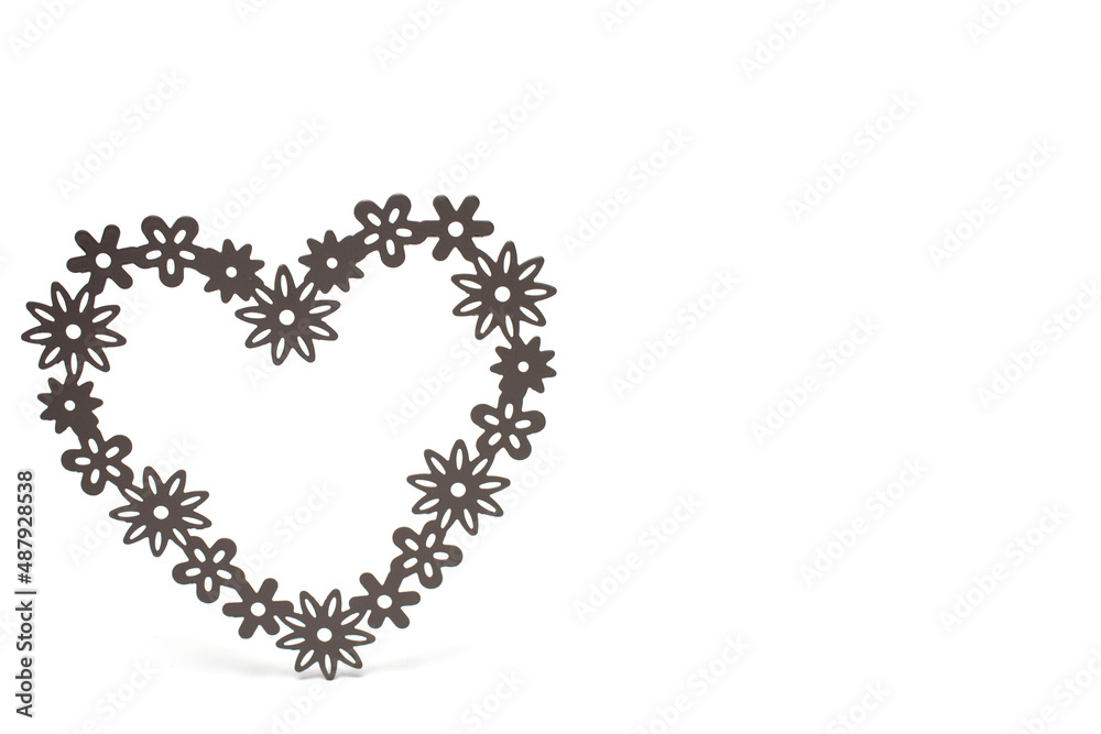 Closeup heart filigree shapes white background concept Closeup heart filigree shapes white background concept