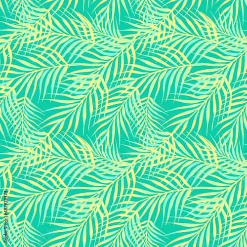 Palm branches seamless pattern on green background 