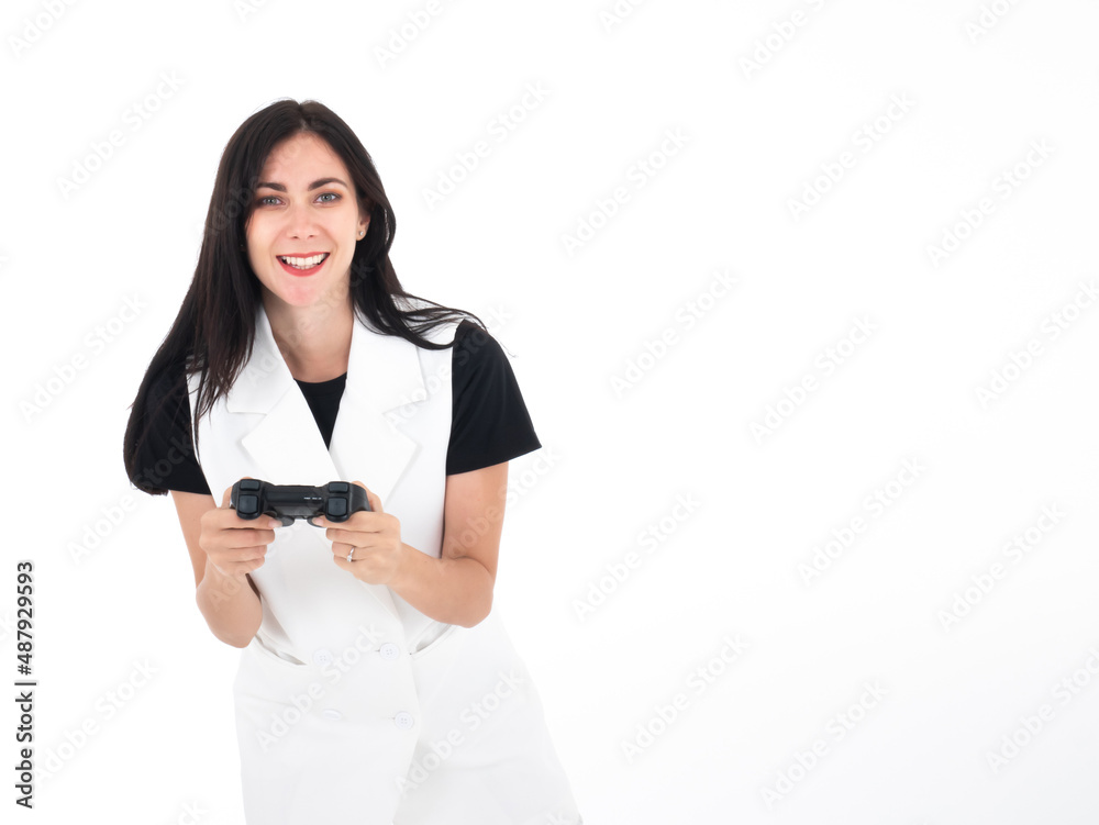 Caucasian adult woman smile playing game with joystick gadget while watching you isolated on white background Caucasian adult woman smile playing game with joystick gadget while watching you isolated on white background