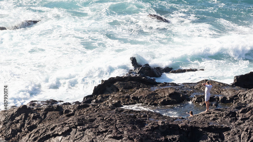 Man at a narutal pool near the the ocean on Lanzarote