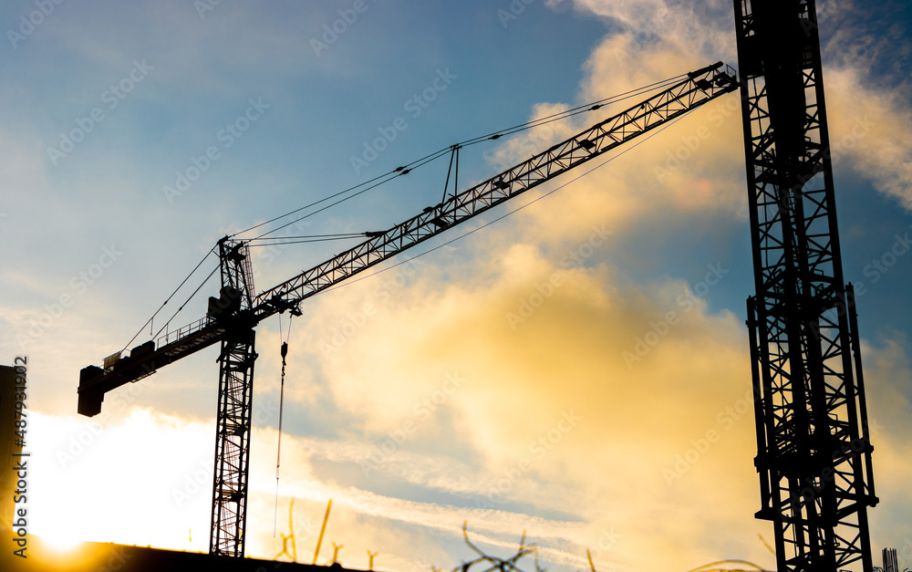 Construction site crane at sunrise