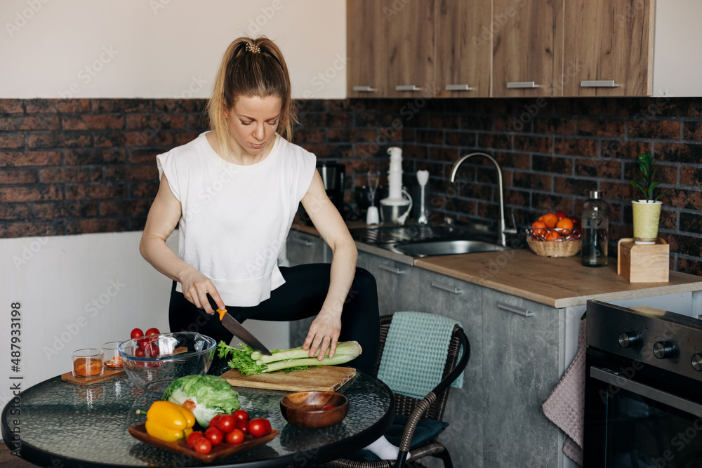 Sports woman cooking healthy eat at home