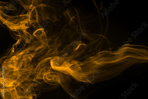 Yellow smoke abstract on black background, dense smoke, fire design