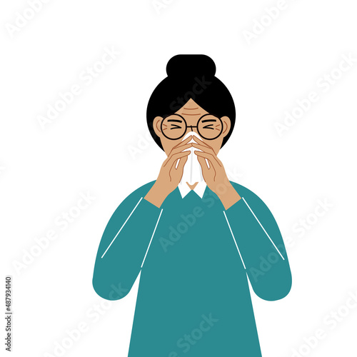 A woman covers his nose with his hands with a handkerchief. The concept of a sick person, sneezing, seasonal allergies, bad smell.