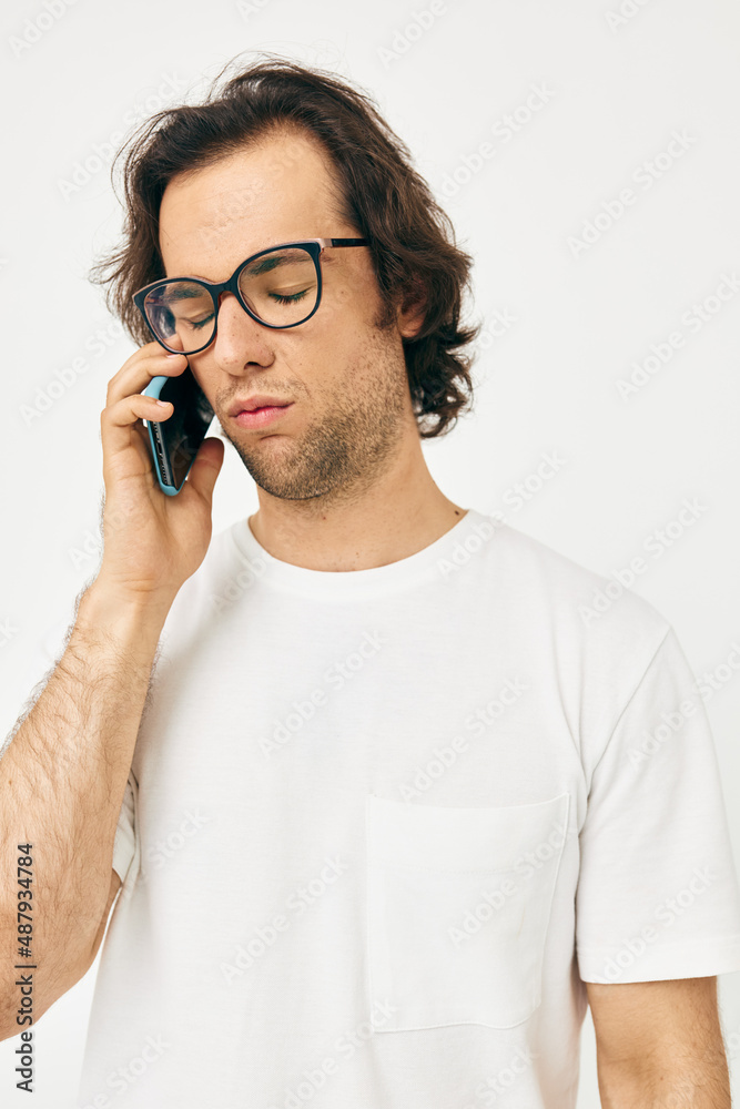 Cheerful man talking on the phone technologies isolated background Cheerful man talking on the phone technologies isolated background