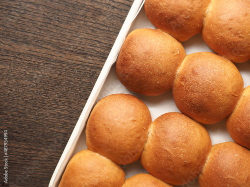 Top view orange-brown bread bun