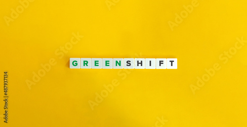Green Shift Phrase on Letter Tiles on Yellow Background. Minimal Aesthetics.