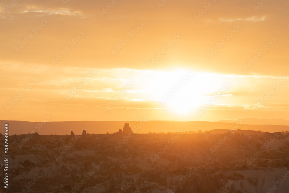 Amazing orange sunrise in Cappadocia, Turkey with soft selective focus. Beauty of nature concept
