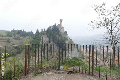 panorama of the clock tower in Brisighella surrounded by the green countryside on a hill that dominates the village