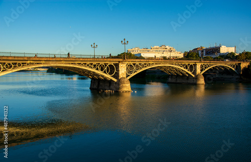 the Triana bridge over the Guadalquivir river in Seville, Spain