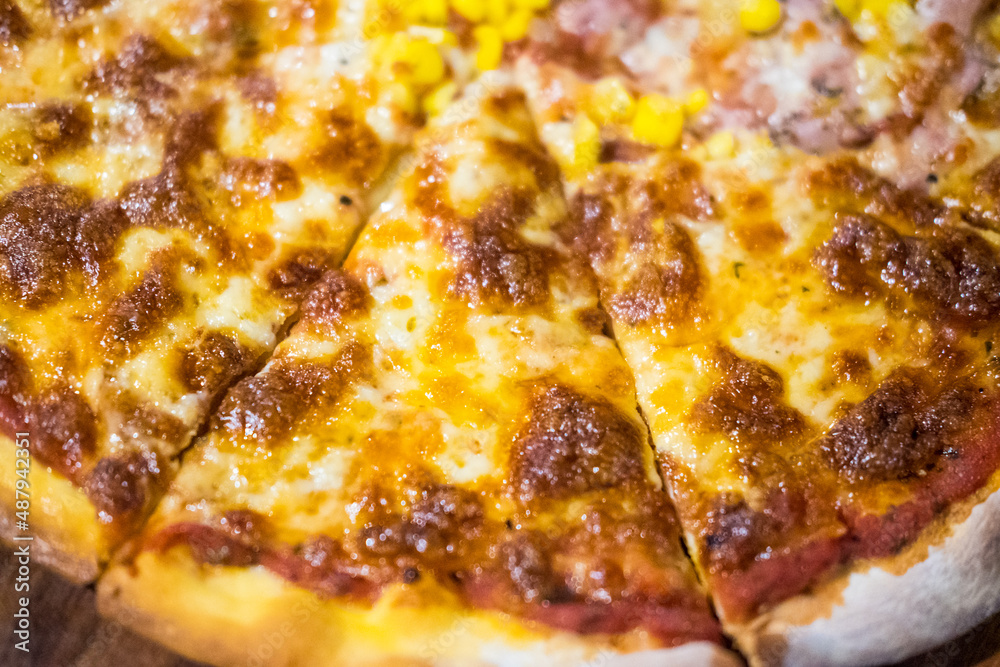 Delicious pizza served on wooden plate Delicious pizza served on wooden plate