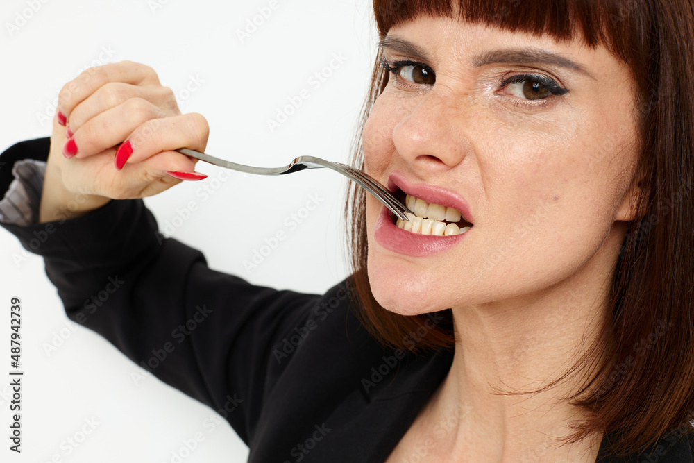 photo pretty woman knife and fork in hands emotions posing Lifestyle unaltered photo pretty woman knife and fork in hands emotions posing Lifestyle unaltered