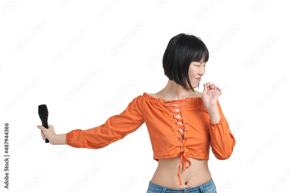 Young asian woman recoiling from a loud sound with microphone, isolated on white background.