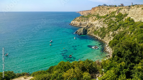 Yachts stand in a bay with azure water near Cape Fiolent