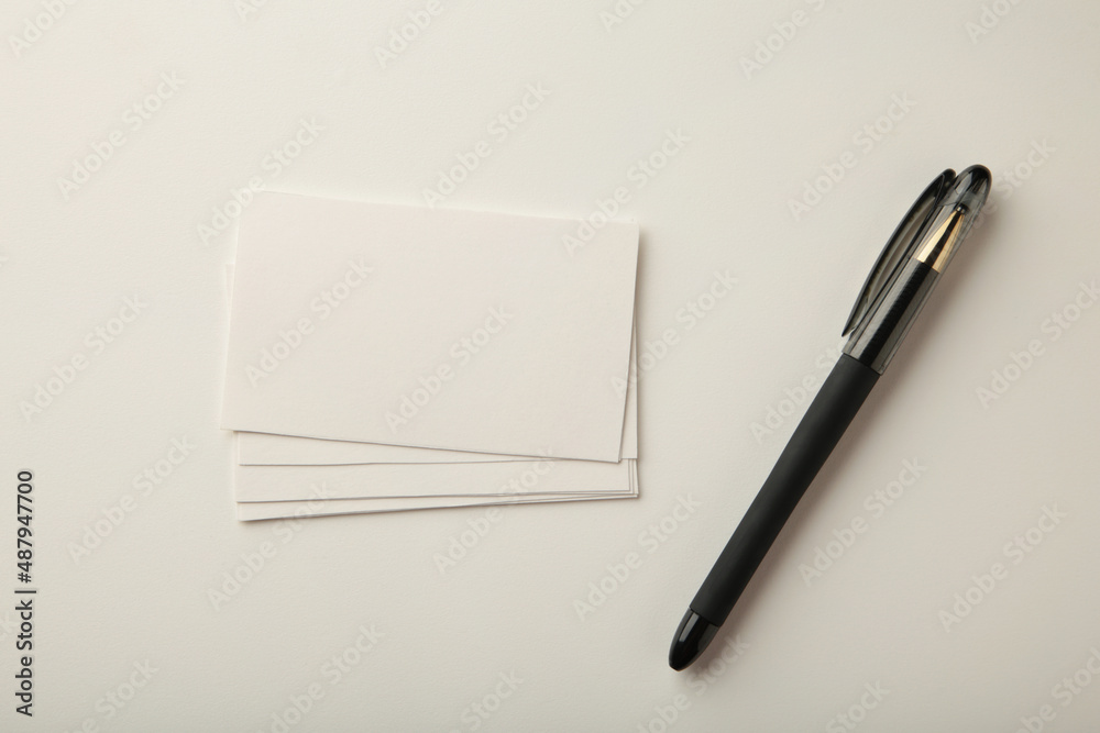 Photo of business cards stack with pen. Template for branding identity. Photo of business cards stack with pen. Template for branding identity.