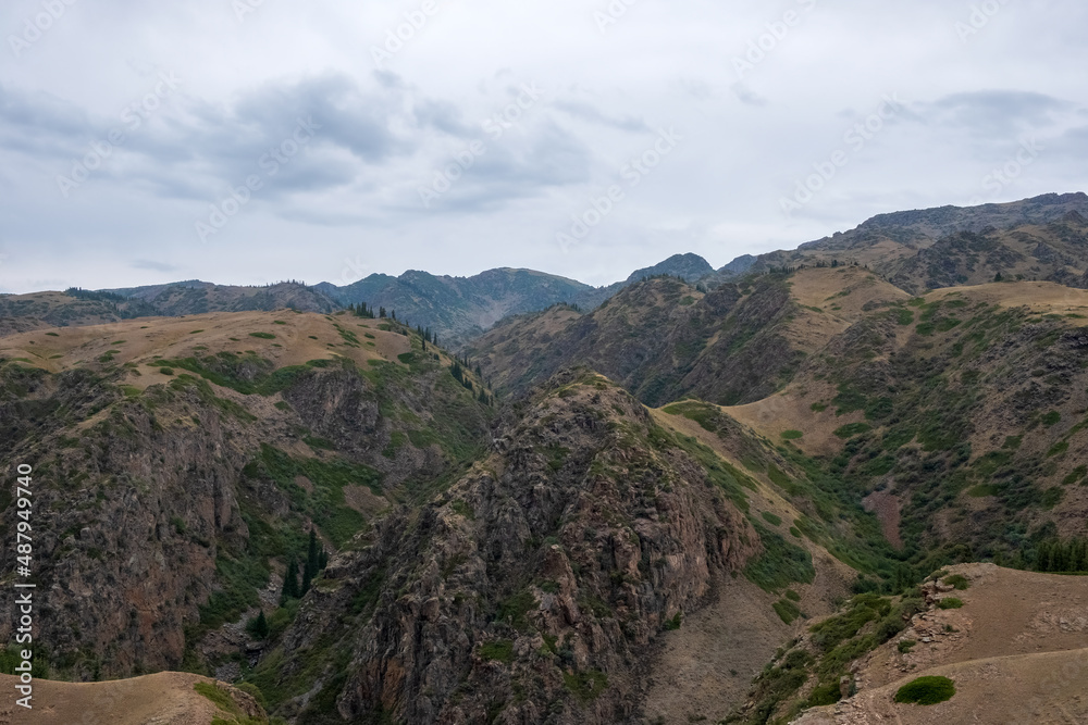 Obraz premium Beautiful river canyon with rocks and bushes. Nature background. Colorful scenery. Assy river canyon