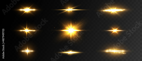A set of flares, bright lights and sparkles on a transparent background. Golden flashes and glare. Abstract golden isolated lights Bright rays of light. Glowing lines.