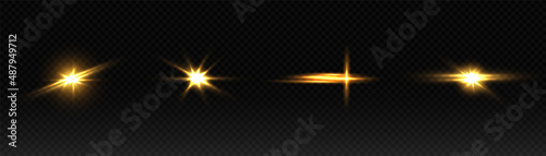 A set of flares, bright lights and sparkles on a transparent background. Golden flashes and glare. Abstract golden isolated lights Bright rays of light. Glowing lines.