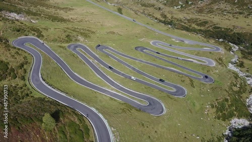 Cars driving along winding mountain road, Susten Pass, Swiss Alps
