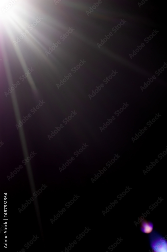 bright rays of light on a dark background. soft focus