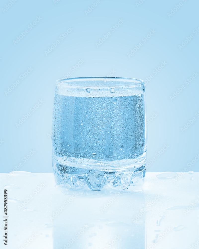 Glass of cold sparkling water with drops Glass of cold sparkling water with drops