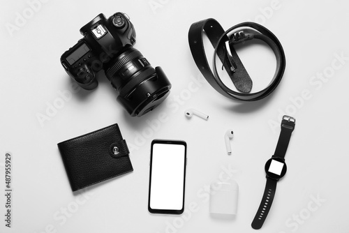 Set of modern gadgets, wallet and belt on white background