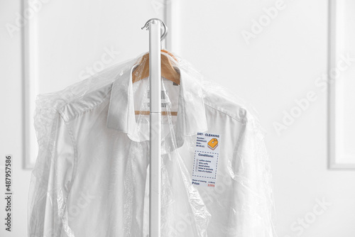 Rack with clean shirts in p...
