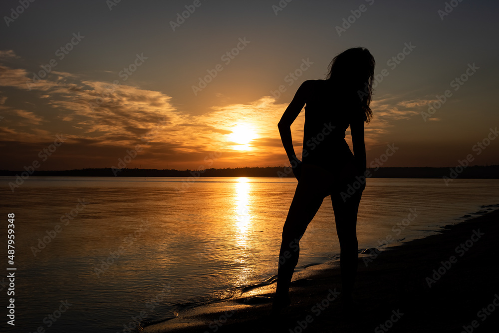 
Woman silhouette at sunset
