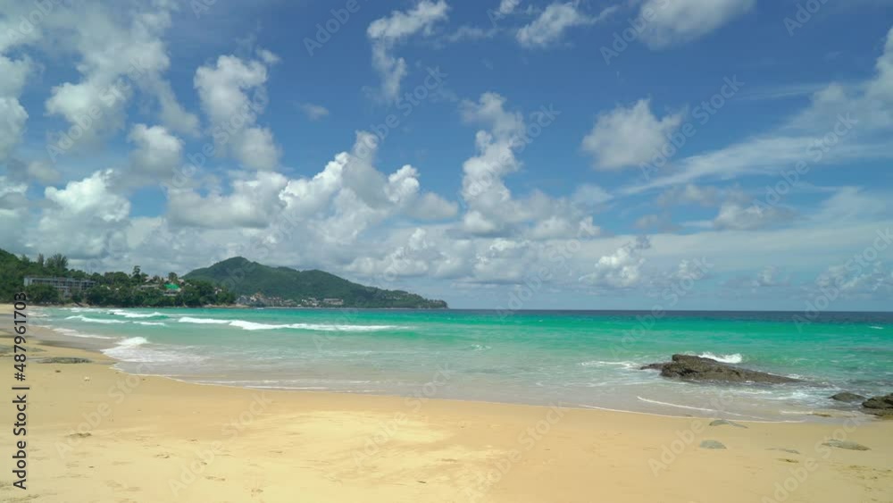 Phuket, Thailand. Beach sea sand and sky. Landscape view of beach sea sand and sky in summer day. Beach space area. At Surin Beach, Phuket, Thailand. On 14 Jan 2022. 4K UHD. Video Clip Phuket, Thailand. Beach sea sand and sky. Landscape view of beach sea sand and sky in summer day. Beach space area. At Surin Beach, Phuket, Thailand. On 14 Jan 2022. 4K UHD. Video Clip