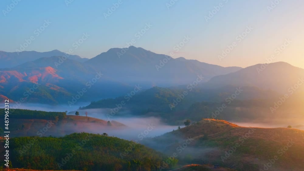 4K : Colorful sunrise over mountains tops in thailand. mountains in the background. wild nature. Time lapse
4K : Colorful sunrise over mountains tops in thailand. mountains in the background. wild nature. Time lapse