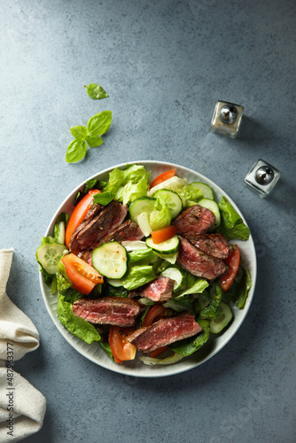 Fresh vegetable salad with beef steak