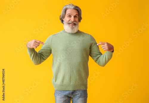 Handsome senior man in knit...