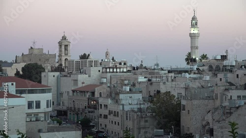 Call for prayer and view towards Mosque of Omar and Church of Nativity in Bethlehem, religion and urban landscape in the West Bank
 photo