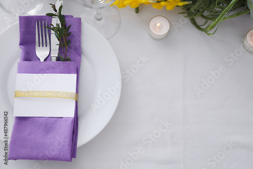 Dining table with beautiful setting and blank card