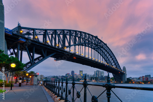 Sydney Harbour Bridge in twilight at Australia. Landscape of building at Sydney central business around the harbour. Aerial view of Sydney business building at dusk.