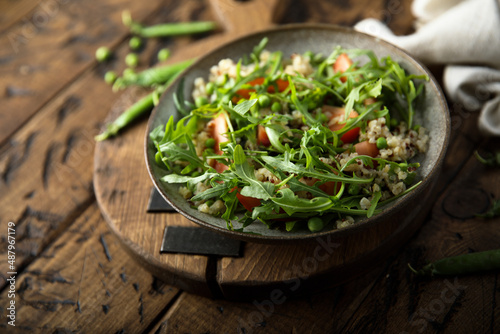 Arugula salad with couscous and tomatoes
