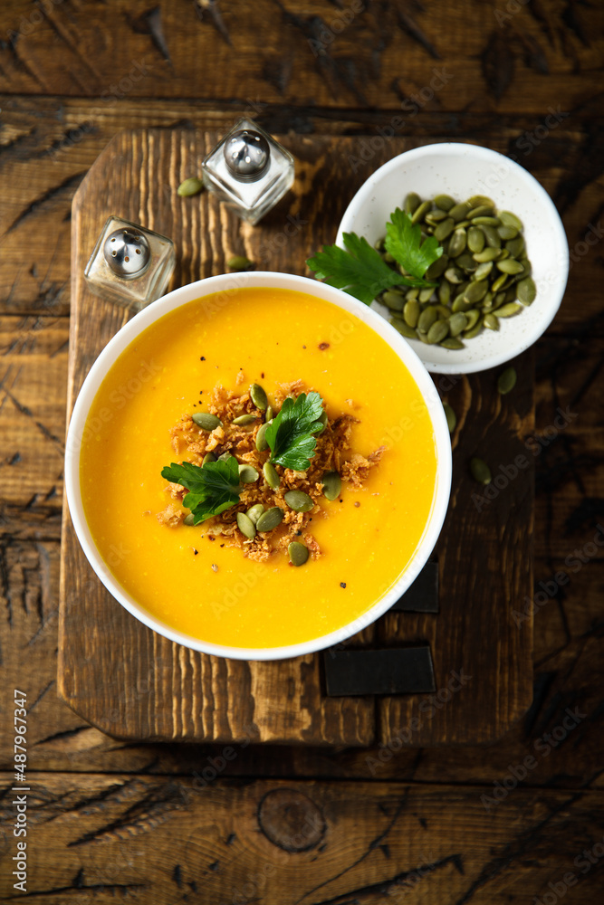 Traditional pumpkin soup with seeds and parsley Traditional pumpkin soup with seeds and parsley