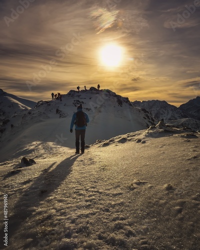 Beautiful winter mountain landscape. A tourist on a trail in the Polish Tatra Mountains.