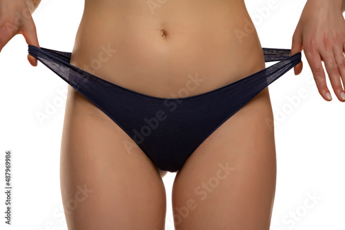 women pulls her elastic panties