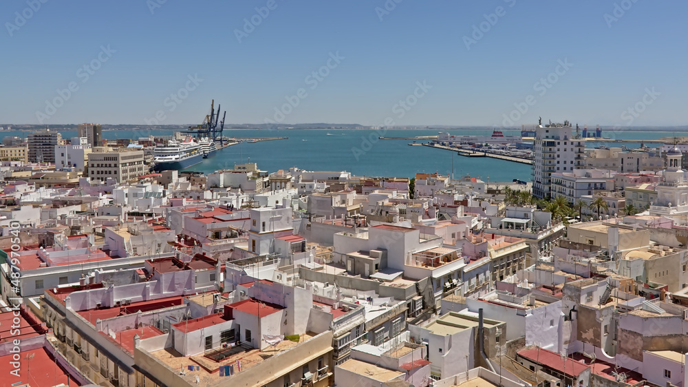 High angle view on the port of Cadiz, with cruiseship and industrial cranes 