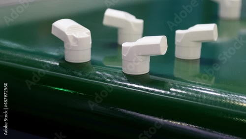 moving parts of the conveyor with plastic products