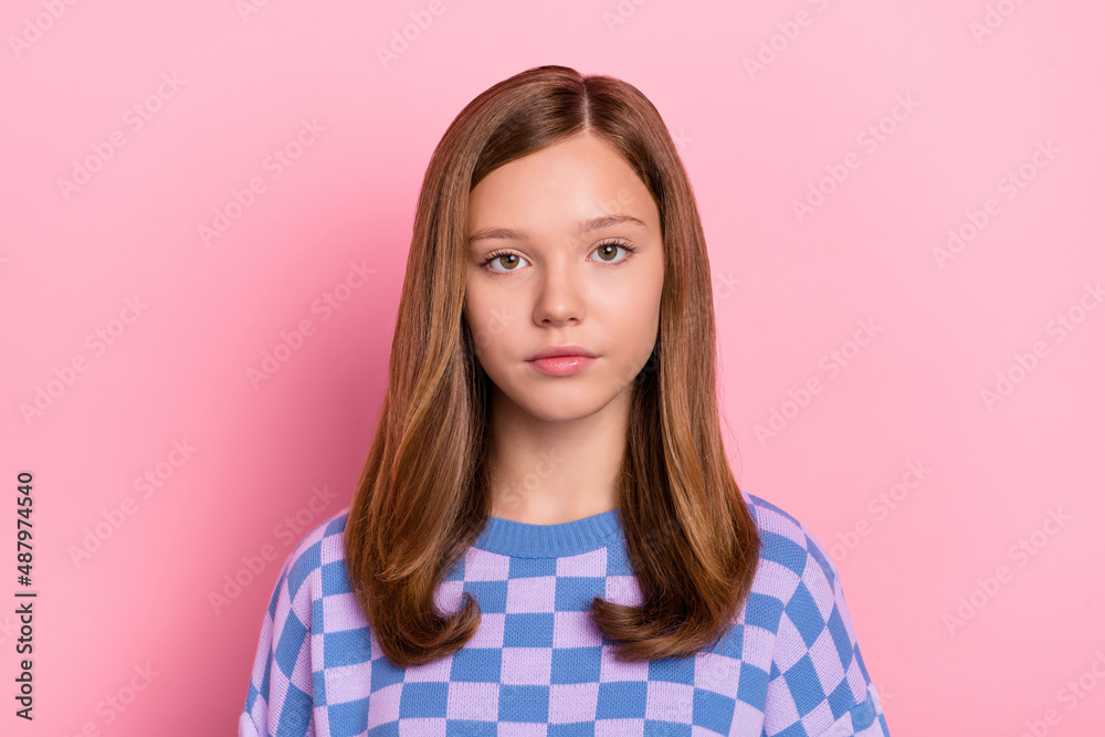 Photo of brown hairdo calm teen girl wear blue sweater isolated on pastel pink color background Photo of brown hairdo calm teen girl wear blue sweater isolated on pastel pink color background
