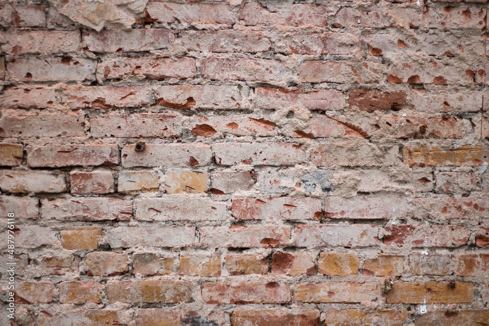 Old brick wall. Loose brick. Surface of wall. Texture of stone. Old brick wall. Loose brick. Surface of wall. Texture of stone.