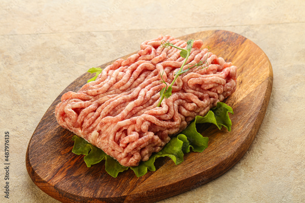 Raw minced pork meat over board Raw minced pork meat over board