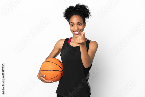 Young basketball player latin woman isolated on white background making money gesture © luismolinero