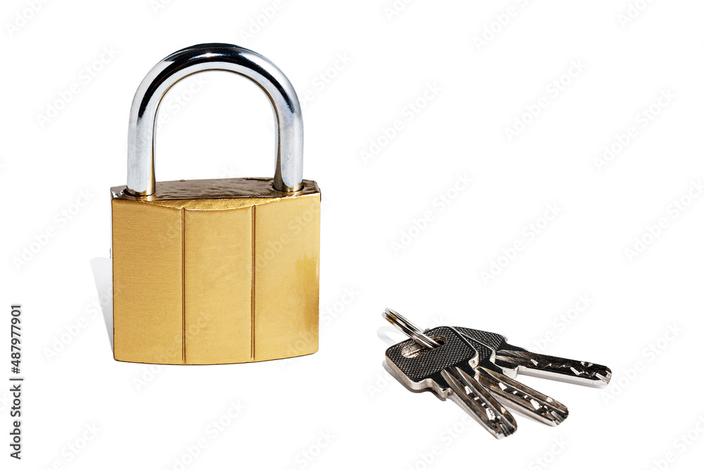 Set of house door keys and lock isolated on white background. The hinged device for secure locking rooms. A bunch of shiny steel new keys on the ring and lock. Set of house door keys and lock isolated on white background. The hinged device for secure locking rooms. A bunch of shiny steel new keys on the ring and lock.