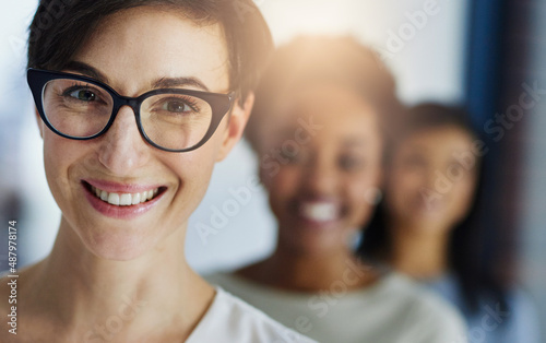 Our team sets the standard for business excellence. Cropped shot of a group of businesspeople standing in the office.