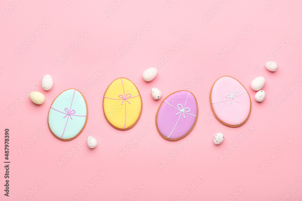 Composition with Easter cookies and quail eggs on color background