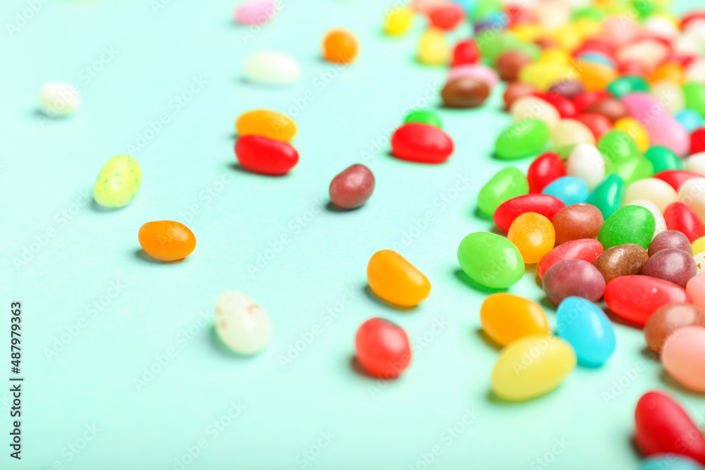 Different jelly beans on color background, closeup Different jelly beans on color background, closeup